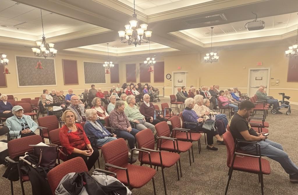 Volunteers talking with seniors